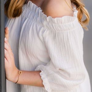 White lulus off the shoulder long sleeve blouse